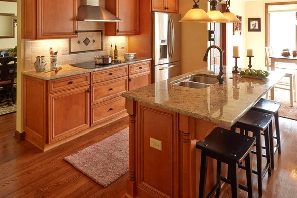 Cherry cabinet kitchen with granite island, range hood, and pendant lighting